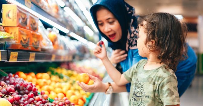 Mother and son grocery shopping.